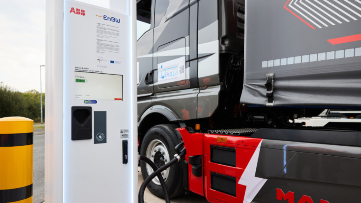 Electric truck connected to a high-power charging station during megawatt charging.