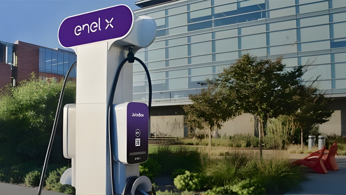 Enel X EV charging station installed outdoors near modern building.