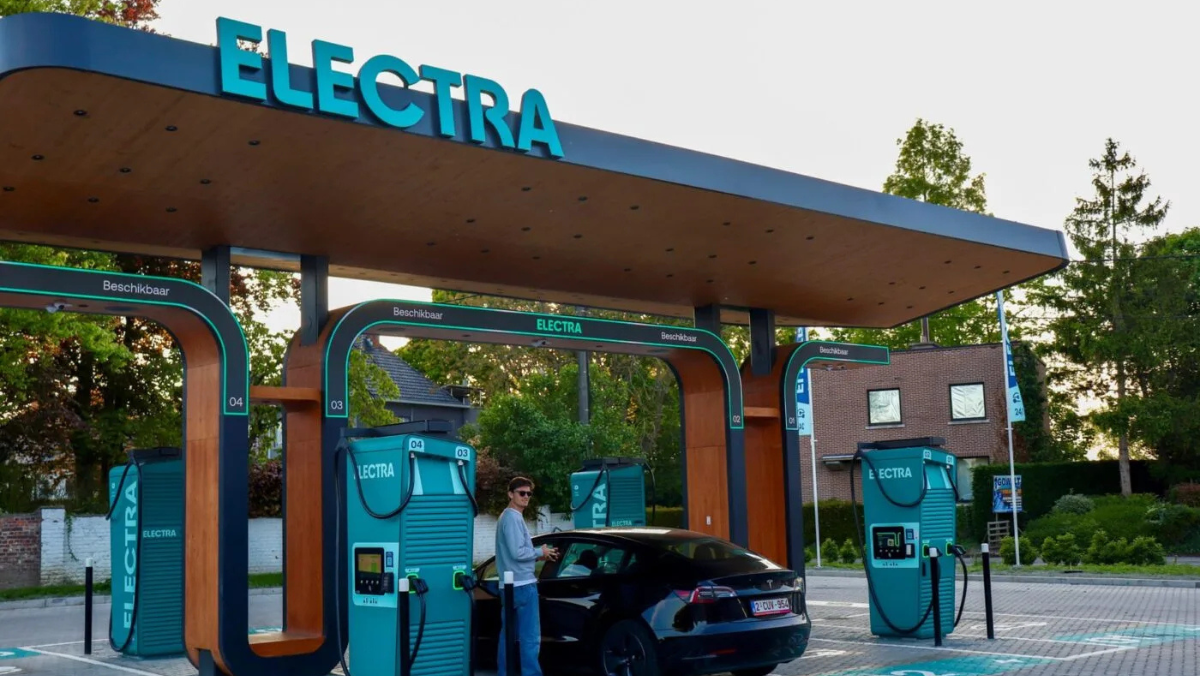 EV driver charging at Electra fast-charging station with Plug and Charge system