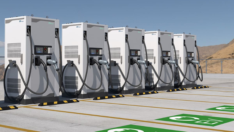 Row of fast electric vehicle chargers installed at an outdoor charging station