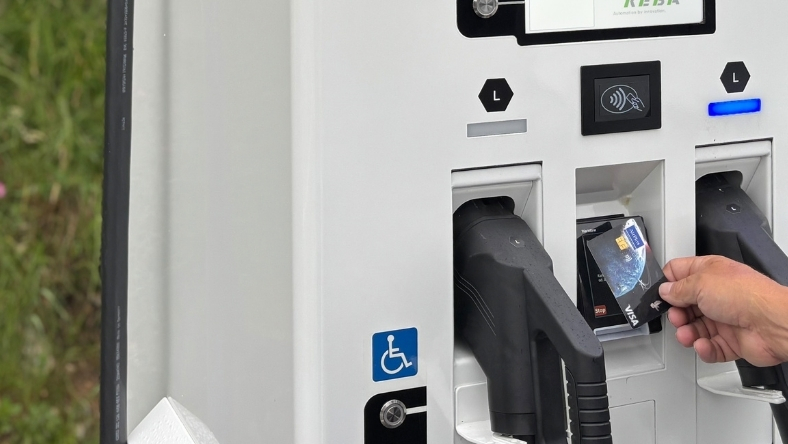 EV charger with payment terminal and charging connector