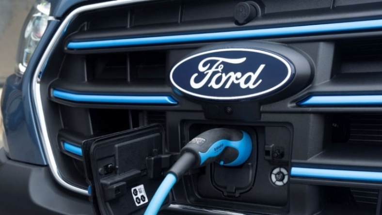 Ford electric vehicle charging port connected to a blue EV charging cable